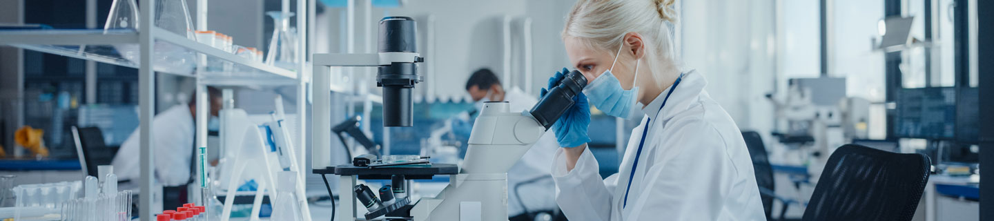doctors performing research using microscopes in the lab